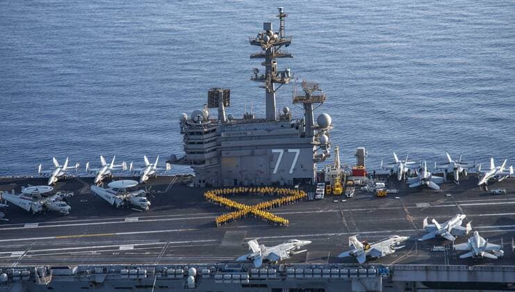 July 22, 2017 - At sea - U.S. sailors form a yellow human ribbon in support of Suicide Prevention and Awareness Month on the flight deck aboard the U.S. Navy Nimitz-class aircraft carrier USS George H.W. Bush July 22, 2017 in the Mediterranean Sea. At sea - ZUMAp138 20170722_zaa_p138_014 Copyright: xDanielxGaitherx