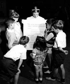 Photograph taken of children of the United Nations International Nursery School looking at a poster of the Universal Declaration of Human Rights. Dated 20th Century WorldxHistoryxArchive 917_05_WHA_099_0027