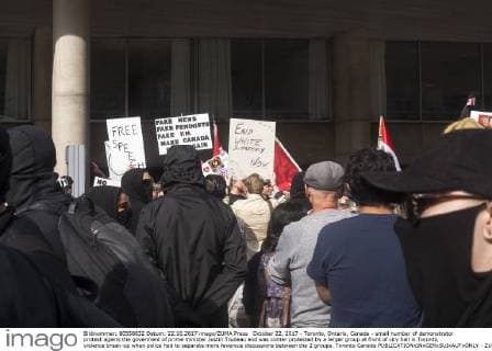 October 22, 2017 - Toronto, Ontario, Canada - small number of demonstrator protest agains the goverment of prime minister Justin Trudeau and was conter protested by a larger group at front of city hall in Toronto, violence break-up when police had to separate more feverous discussions between the 2 groups. Toronto Canada - ZUMAd114 20171022_zap_d114_005 Copyright: xJohnnyxDexFrancox