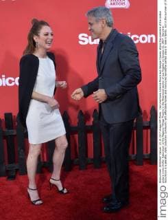Cast members Julianne Moore and George Clooney attend the premiere of the motion picture crime thriller Suburbicon at the Regency Village Theatre in the Westwood section of Los Angeles on October 22, 2017. Storyline: Suburbicon is a peaceful, idyllic suburban community with affordable homes and manicured lawnsÉthe perfect place to raise a family, and in the summer of 1959, the Lodge family is doing just that. But the tranquil surface masks a disturbing reality, as husband and father Gardner Lodge (Matt.Damon) must navigate the townÕs dark underbelly of betrayal, deceit, and violence. This is a tale of.very flawed people making very bad choices. This is Suburbicon.  LAP2017102230 JIMxRUYMEN