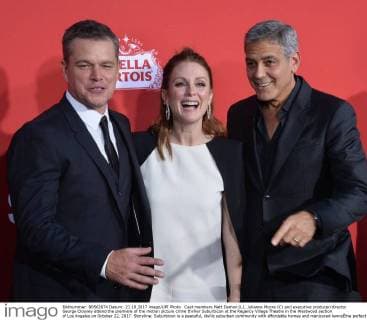 Cast members Matt Damon (L), Julianne Moore (C) and executive producer director George Clooney attend the premiere of the motion picture crime thriller Suburbicon at the Regency Village Theatre in the Westwood section of Los Angeles on October 22, 2017. Storyline: Suburbicon is a peaceful, idyllic suburban community with affordable homes and manicured lawnsÉthe perfect place to raise a family, and in the summer of 1959, the Lodge family is doing just that. But the tranquil surface masks a disturbing reality, as husband and father Gardner Lodge (Matt.Damon) must navigate the townÕs dark underbelly of betrayal, deceit, and violence. This is a tale of.very flawed people making very bad choices. This is Suburbicon.  LAP2017102246 JIMxRUYMEN