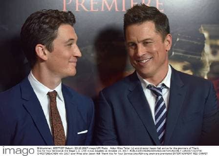 Actor Miles Teller (L) and director Jason Hall arrive for the premiere of Thank You for Your Service at the Regal L.A. LIVE in Los Angeles on October 23, 2017.  LAP20171023730 CHRISTINExCHEW