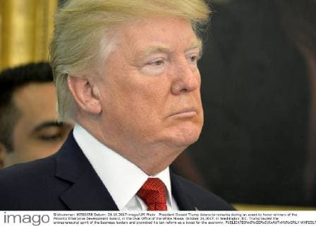 President Donald Trump listens to remarks during an event to honor winners of the Minority Enterprise Development Award, in the Oval Office of the White House, October 24,2017, in Washington, DC. Trump lauded the entrepreneurial spirit of the business leaders and promoted his tax reform as a boost for the economy.  WAP20171024504 MIKExTHEILER