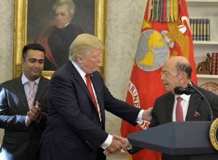 President Donald Trump shakes hands with Labor Secretary Wilbur Ross during an event to honor winners of the Minority Enterprise Development Award in the Oval Office of the White House, October 24,2017, in Washington, DC. Trump lauded the entrepreneurial spirit of the business leaders and promoted his tax reform as a boost for the economy.  WAP20171024505 MIKExTHEILER