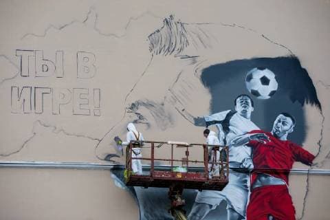 MOSCOW, RUSSIA - OCTOBER 28, 2017: Artists paint a graffiti on a wall in Moscow s Zatsepsky Val Street ahead of the 2018 FIFA World Cup. Sergei Bobylev TASS  TS066E7A