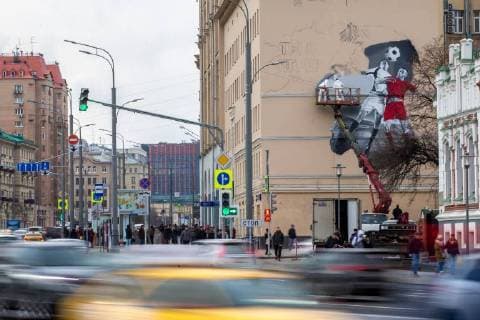 MOSCOW, RUSSIA - OCTOBER 28, 2017: Artists paint a graffiti on a wall in Moscow s Zatsepsky Val Street ahead of the 2018 FIFA World Cup. Sergei Bobylev TASS  TS066E82