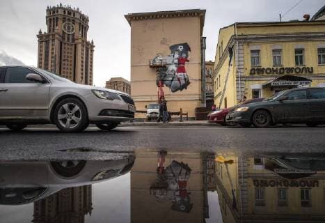 MOSCOW, RUSSIA - OCTOBER 28, 2017: Artists paint a graffiti on a wall in Moscow s Zatsepsky Val Street ahead of the 2018 FIFA World Cup. Sergei Bobylev TASS  TS066E83