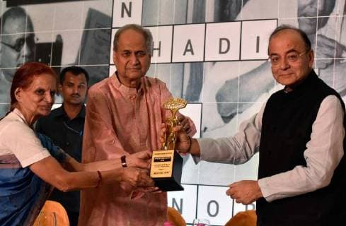 MUMBAI, INDIA - OCTOBER 28: Finance Minister and Minister of Corporate Affairs Arun Jaitley with Chairman and Board of Trustees Rahul Bajaj facilitates Shashi Tyagi, Founder and Secretary of Gramin Vikas Vigyan Samiti during the 40th Jamnalal Bajaj Foundation Awards at The Taj Mahal Palace Hotel, on October 28, 2017 in Mumbai, India. Every year, these awards of the Foundation are given to honor and encourage the unprecedented contributions of individuals towards the upliftment and development of the society, rural community and the nation, at large. (Photo by Kunal Patil Hindustan Times ) Finance Minister Arun Jaitley Attends 40th Jamnalal Bajaj Foundation Awards