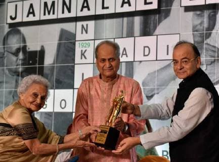 MUMBAI, INDIA - OCTOBER 28: Finance Minister and Minister of Corporate Affairs Arun Jaitley with Chairman and Board of Trustees Rahul Bajaj facilitates Praveen Nair, Founder Trustee of Salaam Baalak Trust during the 40th Jamnalal Bajaj Foundation Awards at The Taj Mahal Palace Hotel, on October 28, 2017 in Mumbai, India. Every year, these awards of the Foundation are given to honor and encourage the unprecedented contributions of individuals towards the upliftment and development of the society, rural community and the nation, at large. (Photo by Kunal Patil Hindustan Times ) Finance Minister Arun Jaitley Attends 40th Jamnalal Bajaj Foundation Awards