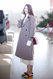 Chinese model He Sui is pictured at the Beijing Capital International Airport in Beijing, China, 30 October 2017. Loafer: Bally Bag: Dior Diorama He Sui flashes elegance and charm at Beijing airport  20171030_62018