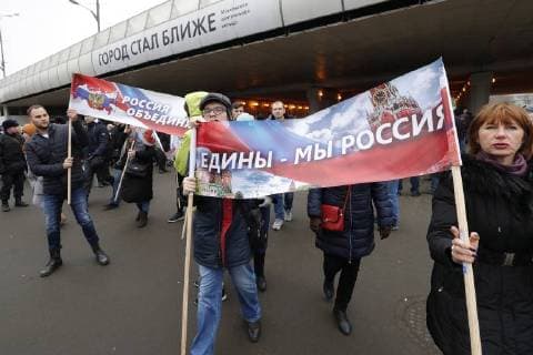 MOSCOW, RUSSIA - NOVEMBER 4, 2017: People carry banners outside Moscow s Luzhniki Stadium ahead of a concert titled Russia Unites! marking Russia s National Unity Day. Mikhail Japaridze TASS  TS067CA8
