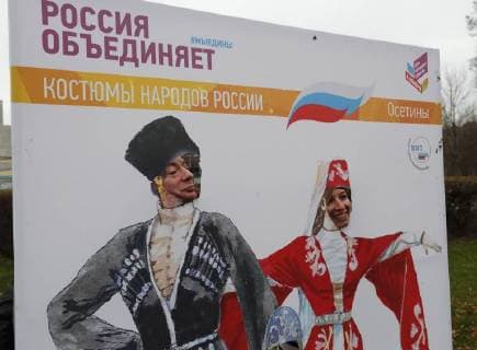 MOSCOW, RUSSIA - NOVEMBER 4, 2017: People pose for a photo outside Moscow s Luzhniki Stadium ahead of a concert titled Russia Unites! marking Russia s National Unity Day. Mikhail Japaridze TASS  TS067CAC