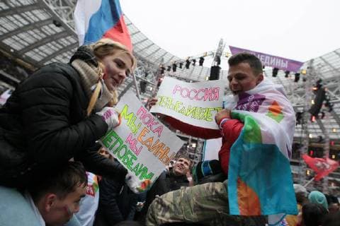 MOSCOW, RUSSIA - NOVEMBER 4, 2017: People hold banners ahead of a concert titled Russia Unites! marking Russia s National Unity Day at Moscow s Luzhniki Stadium. Sergei Bobylev TASS  TS067CEC