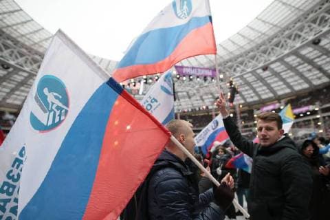 MOSCOW, RUSSIA - NOVEMBER 4, 2017: People wave flags ahead of a concert titled Russia Unites! marking Russia s National Unity Day at Moscow s Luzhniki Stadium. Sergei Bobylev TASS  TS067CEE
