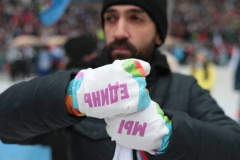MOSCOW, RUSSIA - NOVEMBER 4, 2017: A man wearing gloves with the words We Are United written on them seen ahead of a concert titled Russia Unites! marking Russia s National Unity Day at Moscow s Luzhniki Stadium. Sergei Bobylev TASS  TS067CEF