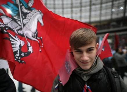 MOSCOW, RUSSIA - NOVEMBER 4, 2017: A teenager with the flag of Moscow seen ahead of a concert titled Russia Unites! marking Russia s National Unity Day at Moscow s Luzhniki Stadium. Sergei Bobylev TASS  TS067CF4