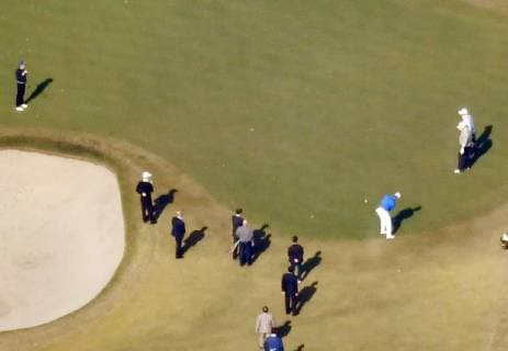 Trump in Japan Professional golfer Hideki Matsuyama (C, blue top) putts as U.S. President Donald Trump (R, front) and Japanese Prime Minister Shinzo Abe (far L) watch at Kasumigaseki Country Club in Kawagoe, Saitama Prefecture, on Nov. 5, 2017. Photo was taken from a Kyodo News helicopter. 