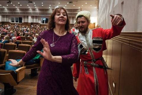 NOVOSIBIRSK, RUSSIA - NOVEMBER 4, 2017: People dance during a concert by the Kuban Cossack Choir perform at Arnold Kats Concert Hall during the 2017 Art Night Festival as Russia celebrates the Day of National Unity. Kirill Kukhmar TASS  TS067EB9