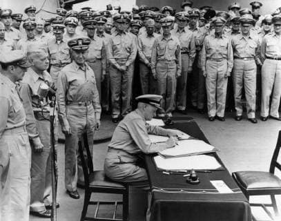 Vintage World War II History photo of Admiral Chester Nimitz signing the Japanese surrender documents aboard the USS Missouri Standing behind Nimitz are General Douglas MacArthur Admiral William Halsey and Admiral Forrest Sherman  Copyright: JohnxParrot StocktrekxImages JPA101265M