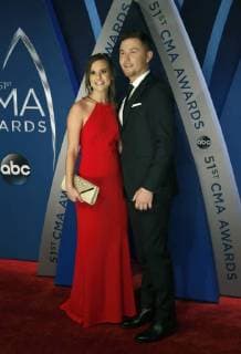 Scotty McCreery and his fiancee Gabi Dugal walk the red carpet as they arrive for the 51st Annual Country Music Association Awards on November 8, 2017 at the Bridgestone Arena in Nashville.  NAS20171108106 JOHNxSOMMERSxII
