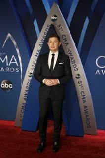 Scotty McCreery walks the red carpet as he arrives for the 51st Annual Country Music Association Awards on November 8, 2017 at the Bridgestone Arena in Nashville.  NAS20171108108 JOHNxSOMMERSxII