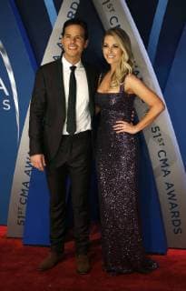 Granger Smith and his wife Amber Bartlett walk the red carpet as they arrive for the 51st Annual Country Music Association Awards on November 8, 2017 at the Bridgestone Arena in Nashville.  NAS20171108134 JOHNxSOMMERSxII