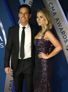 Granger Smith and his wife Amber Bartlett walk the red carpet as they arrive for the 51st Annual Country Music Association Awards on November 8, 2017 at the Bridgestone Arena in Nashville.  NAS20171108135 JOHNxSOMMERSxII