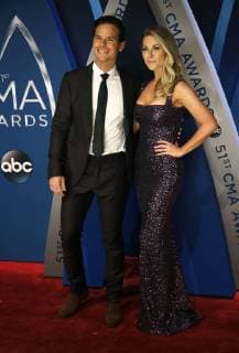 Granger Smith and his wife Amber Bartlett walk the red carpet as they arrive for the 51st Annual Country Music Association Awards on November 8, 2017 at the Bridgestone Arena in Nashville.  NAS20171108136 JOHNxSOMMERSxII