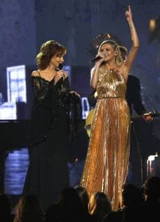 Reba McEntire (L) and Kelsea Ballerini perform onstage during the 51st Annual Country Music Association Awards on November 8, 2017 at the Bridgestone Arena in Nashville.  NAS20171108234 JOHNxSOMMERSxII