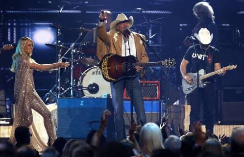 Alan Jackson (C), Carrie Underwood and Brad Paisley perform at the 51st Annual Country Music Association Awards on November 8, 2017 at the Bridgestone Arena in Nashville.  NAS20171108337 JOHNxSOMMERSxII