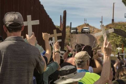 November 12, 2017 - Nogales, Arizona, U.S. - Nogales, Arizona USA - 12 November 2017 - A rally held on both sides of the U.S.-Mexico border fence remembers migrants who have died trying to cross the border. U.S. Border Patrol officers watch from the top of the hill. The rally was organized by the School of the Americas Watch, a group of religious and community activists. Nogales U.S. - ZUMAw66_ 20171112_zaf_w66_002 Copyright: xJimxWestx