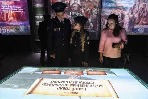 NOVOSIBIRSK, RUSSIA - NOVEMBER 12, 2017: People view a multimedia exhibition at the Russia â€“ My History historical park opened in Oktyabrsky District. Kirill Kukhmar TASS  TS068C7E