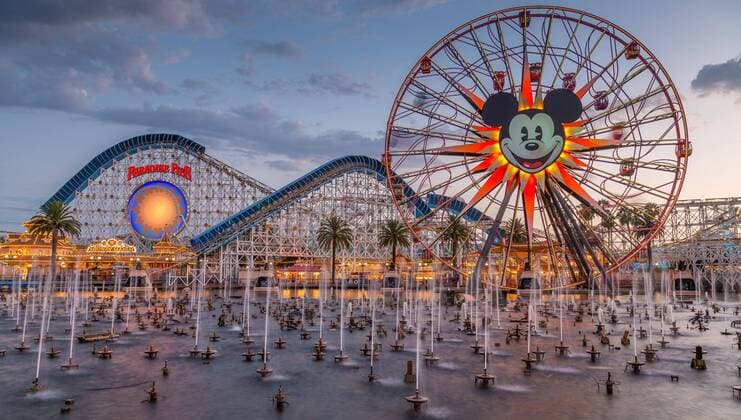 Ferris wheel Mickey S Fun Wheel and Roller coaster California Screamin front Lake Paradise Bay with Water fountains California Adventure Park Disneyland Resort Anaheim California USA North America Copyright: imageBROKER MarcxRasmus iblmra04590914.jpg