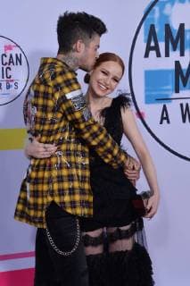 Travis Mills (L) and Madelaine Petsch arrive for the annual American Music Awards held at Microsoft Theater in Los Angeles, on November 19, 2017.  LAP20171119133 JIMxRUYMEN