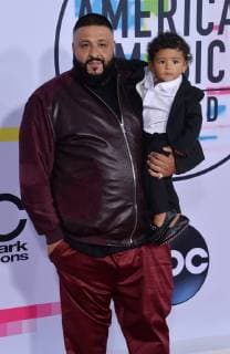 DJ Khaled (L) and his son Asahd Tuck Khaled arrive for the annual American Music Awards held at Microsoft Theater in Los Angeles, on November 19, 2017.  LAP20171119176 JIMxRUYMEN