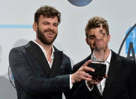 Alex Pall (L) and Andrew Taggart of The Chainsmokers appear backstage after being named Favorite Electronic Dance Music Artist during the annual American Music Awards held at Microsoft Theater in Los Angeles, on November 19, 2017.  LAP20171119195 JIMxRUYMEN