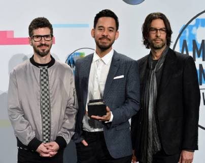 Brad Delson, Mike Shinoda and Rob Bourdon (L-R) of Linkin Park appear backstage after being named Favorite Alternative Rock Artist during the annual American Music Awards held at Microsoft Theater in Los Angeles, on November 19, 2017.  LAP20171119197 JIMxRUYMEN