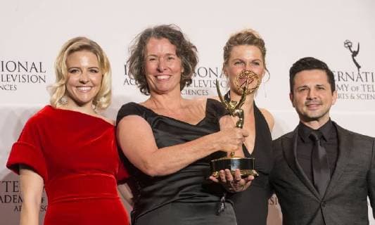 USA: 2017 International Emmy Awards Beatrice Kramm, Lucia Haslauer winner short form series & Helene Yorke, Freddy Rodriguez pose on stage at press room for 2017 Internation Emmy Awards at Hilton Hotel New York New York United States Hilton Hotel  LevxRadin