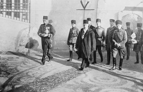 Installation of the new Caliph . The installation of the new Caliph of Islam , Abdul Medjid Effendi , took place at Constantinople . The Caliph in the Courtyard of the Fatih Mosque , where he celebrated his first Selamlik . Rafet Pasha ( right ) , the Angora represdentative in Constantinople , and the General Staff are also seen . 30 November 1922, Constantinople Turkey Copyright: Topfoto  UnitedArchivesEU010453