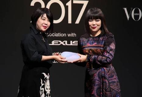 November 24, 2017, Tokyo, Japan - Japanese comedian Buruzon Chiemi (R) receives the trophy of Vogue Japan Women of the Year 2017 award from Vogue Japan chief editor Mitsuko Watanabe in Tokyo on Friday, November 24, 2017.  (lwxa016157)