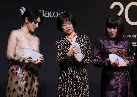 November 24, 2017, Tokyo, Japan - (L-R) Japanese artist Kom I, Naoki award author Riku Onda, comedian Buruzon Chiemi pose for photo as they receive Vogue Japan Women of the Year 2017 award in Tokyo on Friday, November 24, 2017.  (lwxa016181)