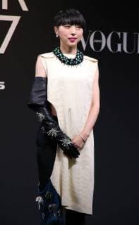 November 24, 2017, Tokyo, Japan - Japanese choreographer Mikiko smiles as she receives the trophy of Vogue Japan Women of the Year 2017 award in Tokyo on Friday, November 24, 2017.  (lwxa016184)