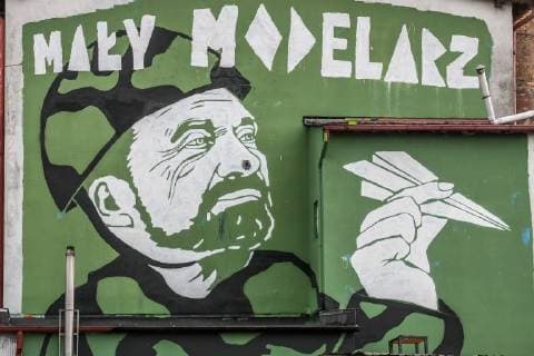 Mural depicting the portrait of a Minister of Defence Antoni Macierwicz with a paper plane in Hand and Little modeler inscription is seen on Gdansk, Poland on 26 November 2017 Mural made by artist Mariusz Waras refers to the indolence of the Minister of Defense Maciereiwcz in reforming the Polish Army, to the announced purchases of military equipment and the broken contract for the delivery of French multi-role helicopters. Gdansk, 26.11.2017 Mural Mariusza Warasa przedstawiajacy ministra Obrony Narodowej jako Malego Modelarza. Minister w wojskowym uniformie trzyma w reku papierowy model samolotu na gorze widnieje napis Maly Modelarz. fot. Michal Fludra Newspix.pl --- Newspix.pl FLUMI_26112017_18703