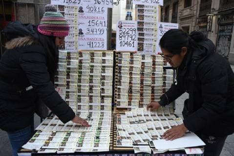 Spain: Long queues in Madrid to buy lottery Two vendors of El Gordo lottery tickets pictured in Madrid. The Spain s famed Christmas lottery will be celebrated on December 22, 2017. It will be distributed more than 2.3 billion euros ($3 billion) in prizes. Madrid Spain  JorgexSanz