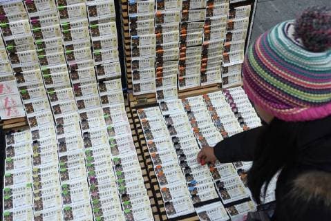 Spain: Long queues in Madrid to buy lottery El Gordo lottery tickets are displayed for sale in Madrid. The Spain s famed Christmas lottery will be celebrated on December 22, 2017. It will be distributed more than 2.3 billion euros ($3 billion) in prizes. Madrid Spain  JorgexSanz