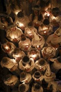 December 12, 2017 - Minneapolis, MN, U.S.A - Members of the 2017 Lucia Choir crowded the stairway of the Grand Hall during their performance Tuesday evening. JEFF WHEELER ¢ jeff.wheeler@startribune.com ....The American Swedish Institute ushered in the holiday season with their annual Lucia in the Mansion Concert in the Turnblad Mansion Grand Hall Tuesday night, December 12, 2017 in Minneapolis. The 2017 Lucia Choir performed at the traditional Advent festival to commemorate Saint Lucy, (Sankta Lucia in Swedish) the 3rd century martyr who according to legend brought food and aid to Christians hiding in catacombs using a candle-lit wreath to light her way and leave her hands free to carry as much food as possible, according to a wikipedia article. Minneapolis U.S.A. - ZUMAm42_ 20171212_zaf_m42_024 Copyright: xJeffxWheelerx