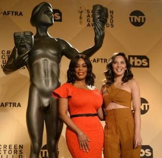 Actresses Niecy Nash (L) and Olivia Munn gather for a photo-op after announcing the nominations for the 24th annual SAG Awards at the Pacific Design Center in West Hollywood, California on December 13, 2017. Winners will be announced during a live Simulcast on Sunday, January 21.  LAP2017121315 JIMxRUYMEN