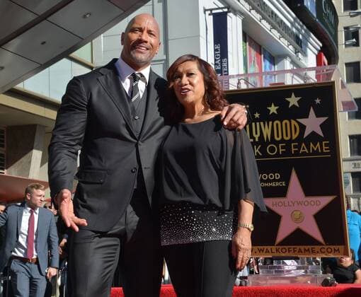 Actor Dwayne Johnson, aka The Rock is joined by his mother Ata Johnson during an unveiling ceremony honoring Johnson with the 2,624th star on the Hollywood Walk of Fame in Los Angeles on December 13, 2017.  LAP2017121341 JIMxRUYMEN