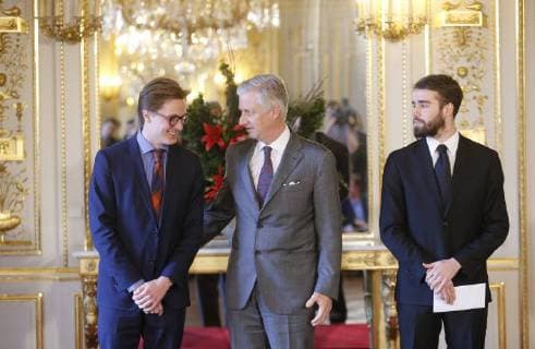 King Philippe - Filip of Belgium (C) congratulates laureates Ruben Matthys (L) and Milan Berckmans (R) at the award ceremony of the thirteenth edition of the Belgodyssee prize for young journalists, at the Royal Palace in Brussels, Thursday 14 December 2017.  NICOLASxMAETERLINCK 05218411