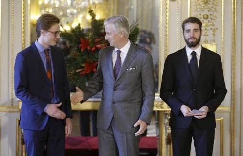Ruben Matthys, King Philippe - Filip of Belgium and Milan Berckmans pictured during the award ceremony of Belgodyssee at Royal Palace, Thursday 14 December 2017 in Brussels.  NICOLASxMAETERLINCK 05218700